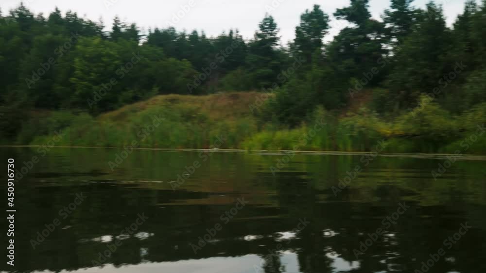 river in summer. reflection of trees in the water. panorama from the water. summer river landscape. 4k river in summer. reflection of trees in the water. panorama from the water. summer river landscape. 4k