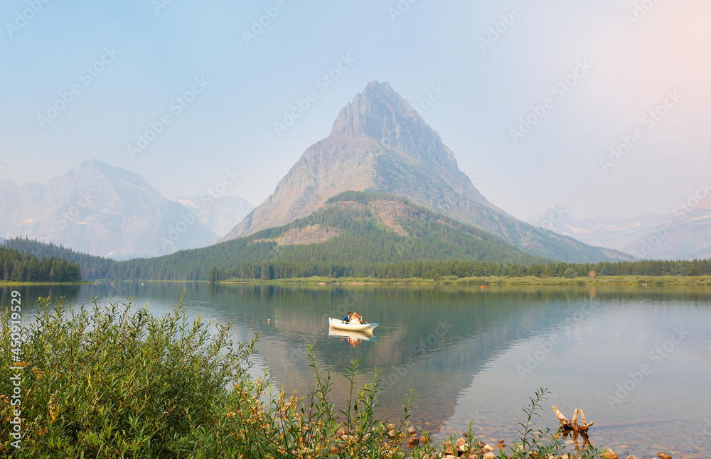 Overview of beautiful sunrise of Boat Loading Dock at Swiftcurrent Lake. Swiftcurrent Lake is located in the Many Glacier region of Glacier National Park, in the U.S. state of Montana.
