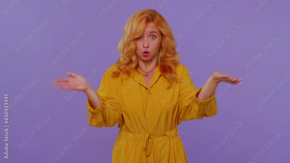 How could you. Frustrated long haired girl screams from stress tension problems feels horror hopelessness fear surprise shock expresses gestures rage. Young woman on purple studio wall background How could you. Frustrated long haired girl screams from stress tension problems feels horror hopelessness fear surprise shock expresses gestures rage. Young woman on purple studio wall background