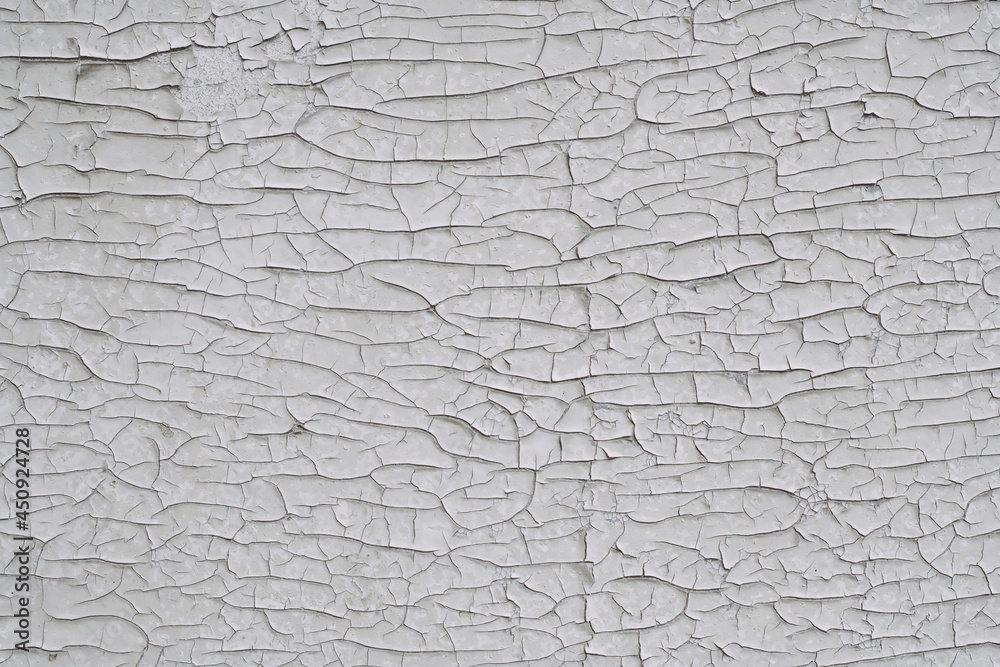 Background texture. Surface with white old cracked paint. Top view, copy space Background texture. Surface with white old cracked paint. Top view, copy space