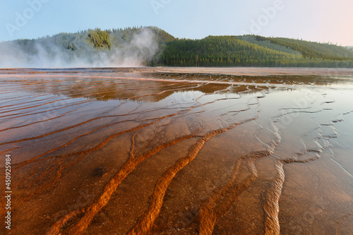 Closeup of the grand prismatic geyser in midway basin at sunset, Yellowstone National Park. Yellowstone National Park is located in Wyoming, USA