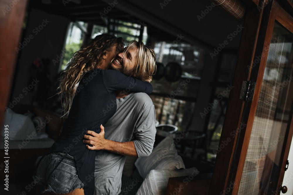 Positive boy and girl enjoy relaxing in warm country and hugging
