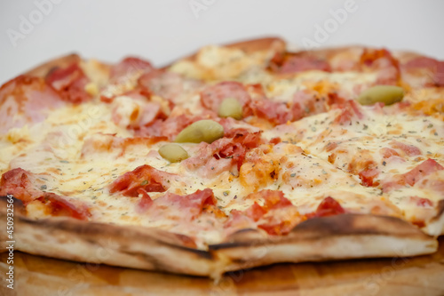 Large sliced Canadian chicken pizza with delicious flavor. 