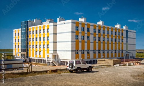 A school building in a northern settlement in the Arctic. Modern school education in the Far North of Russia. Ugolnye Kopi, Chukotka, Siberia, Russia. photo