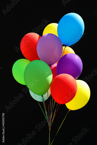 Bunch of colorful balloons on black background