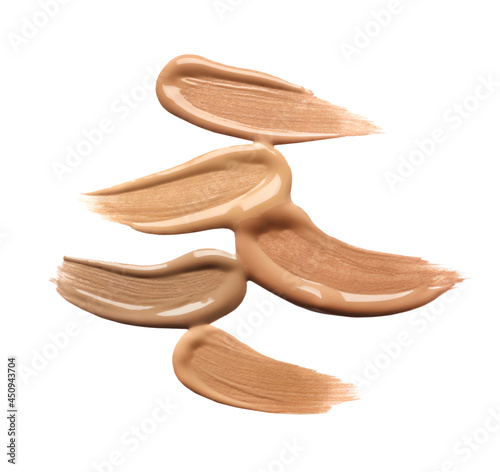 Samples of liquid skin foundation on white background, top view. Space for text