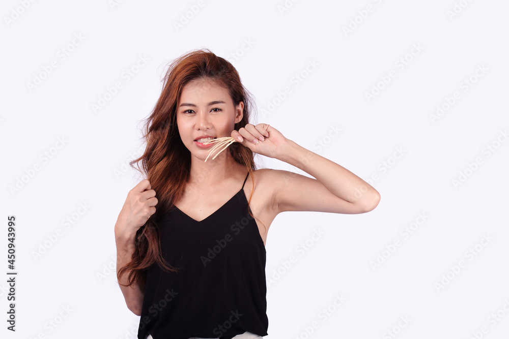 Close-up photo of an amazing long and sexy woman with long hair. Cute Asian woman smiling bright facial expression isolated on white background.