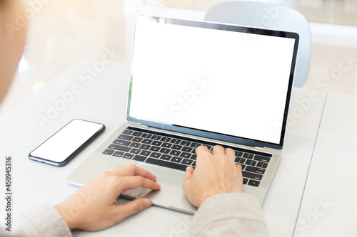 computer screen blank mockup.hand woman work using laptop with white background for advertising,contact business search information on desk at coffee shop.marketing and creative design