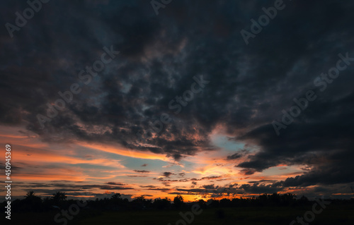 Dramatic twilight sky and cloud sunset background © Keopaserth