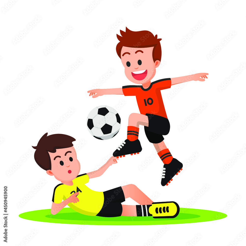 Young football player avoids a sliding tackle from his opponent Young football player avoids a sliding tackle from his opponent