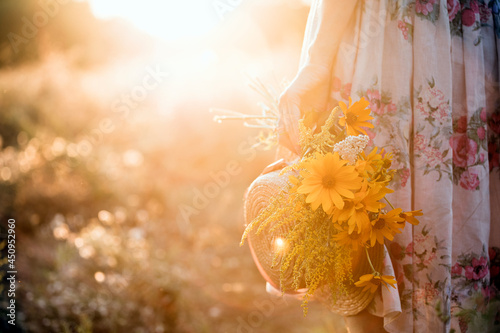 girl in the field at sunset