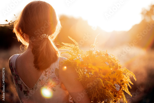 girl in the field at sunset