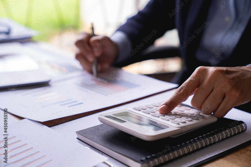 business woman using calculator, renter checking bills, planning budget, sitting at desk with financial documents and receipts, accounting expenses, calculating money, rent or mortgage payment business woman using calculator, renter checking bills, planning budget, sitting at desk with financial documents and receipts, accounting expenses, calculating money, rent or mortgage payment