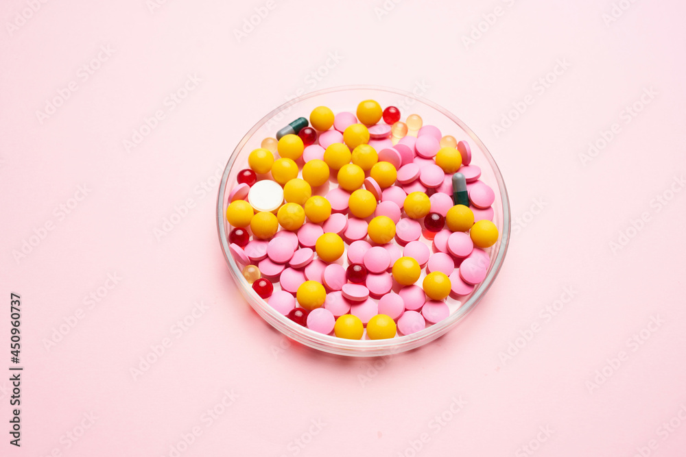 medicine colorful plates pink background close-up antibiotics medicine colorful plates pink background close-up antibiotics