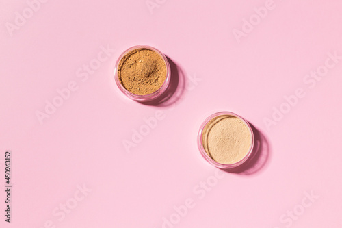 Mineral powder foundation isolated on a pink background. Eco-friendly and organic beauty products