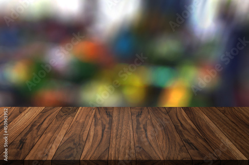 Empty wood table on blurred background copy space for montage your product or design,Blank brown board with abstract blurred background