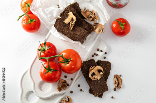 Natural gluten-free bread without flour and sugar with mushrooms and tomatoes, top view