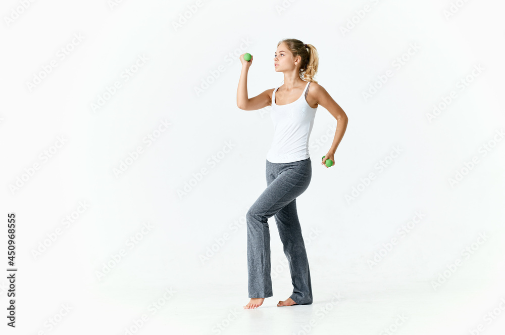 woman in sports uniform with dumbbells in hands workout motivation slim figure woman in sports uniform with dumbbells in hands workout motivation slim figure