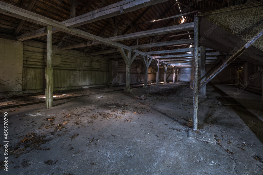 inside dark abandoned ruined wooden decaying hangar with rotting columns inside dark abandoned ruined wooden decaying hangar with rotting columns