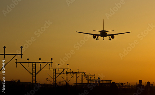 Plane landing on the runway 25R at Barcelona airport; Barcelona, Spain