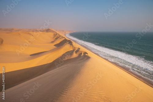 Surreal natural landscape of desert and sea. The topography of the Atlantic coast of Africa. Areas with scarce water resources. Popular travel destination in Namibia.