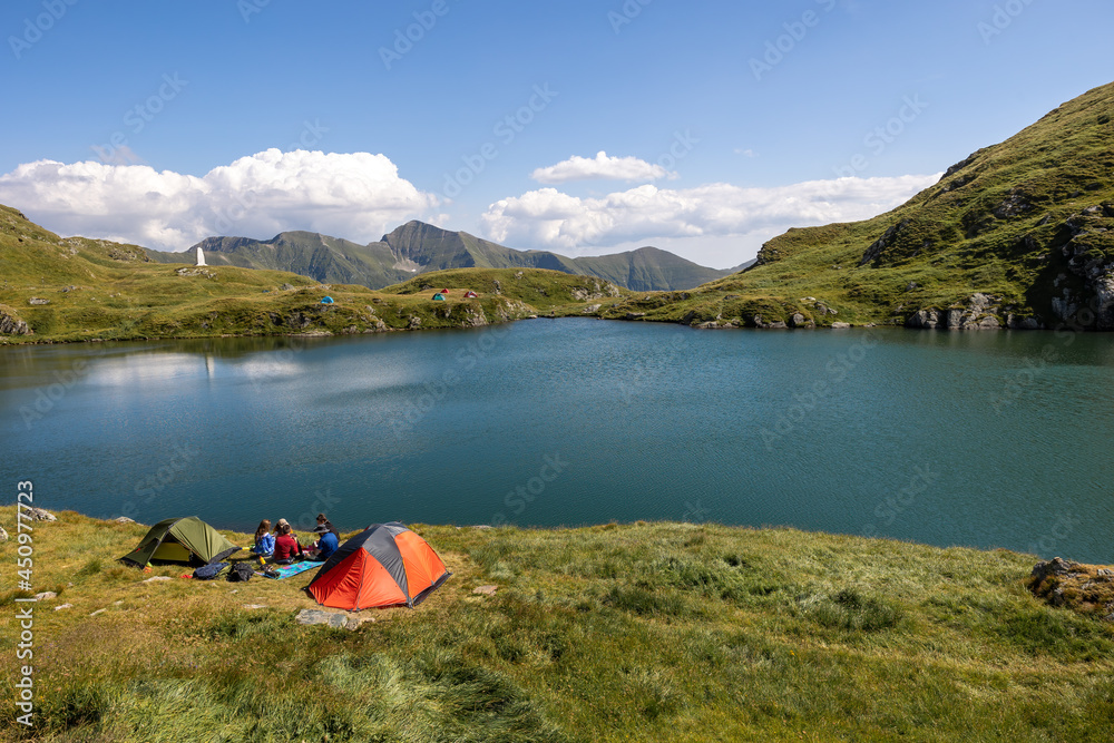 Camping tents on capra mountain lake in fagaras mountains romania