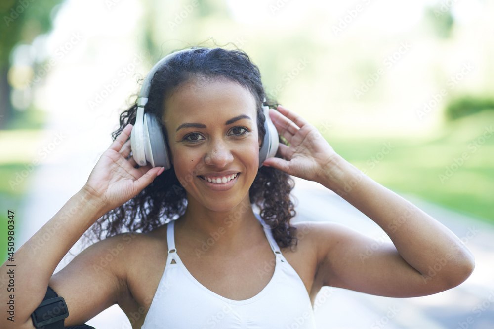portrait of a sporty young woman with headphones. portrait of a sporty young woman with headphones.
