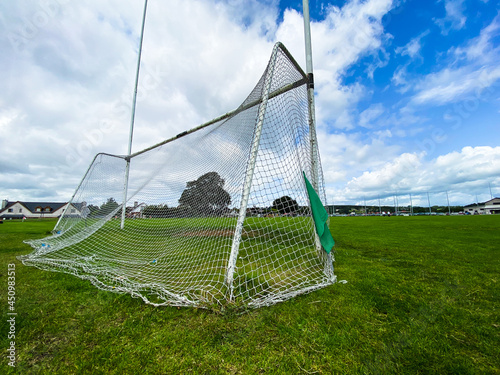 A Gaelic games goal on a summer cloudy day with nobody on the pitch