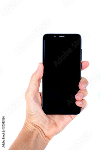 Close view of a woman hand holding a cell phone on a white background.