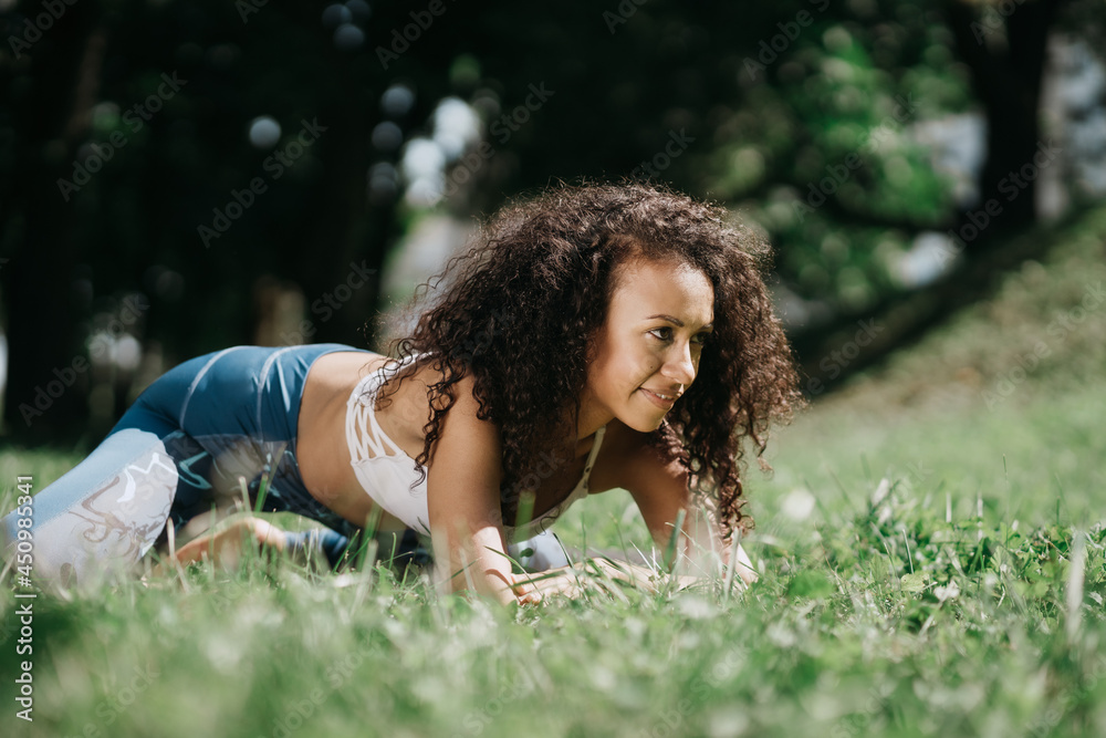 athletic young woman relaxing after a workout . athletic young woman relaxing after a workout .