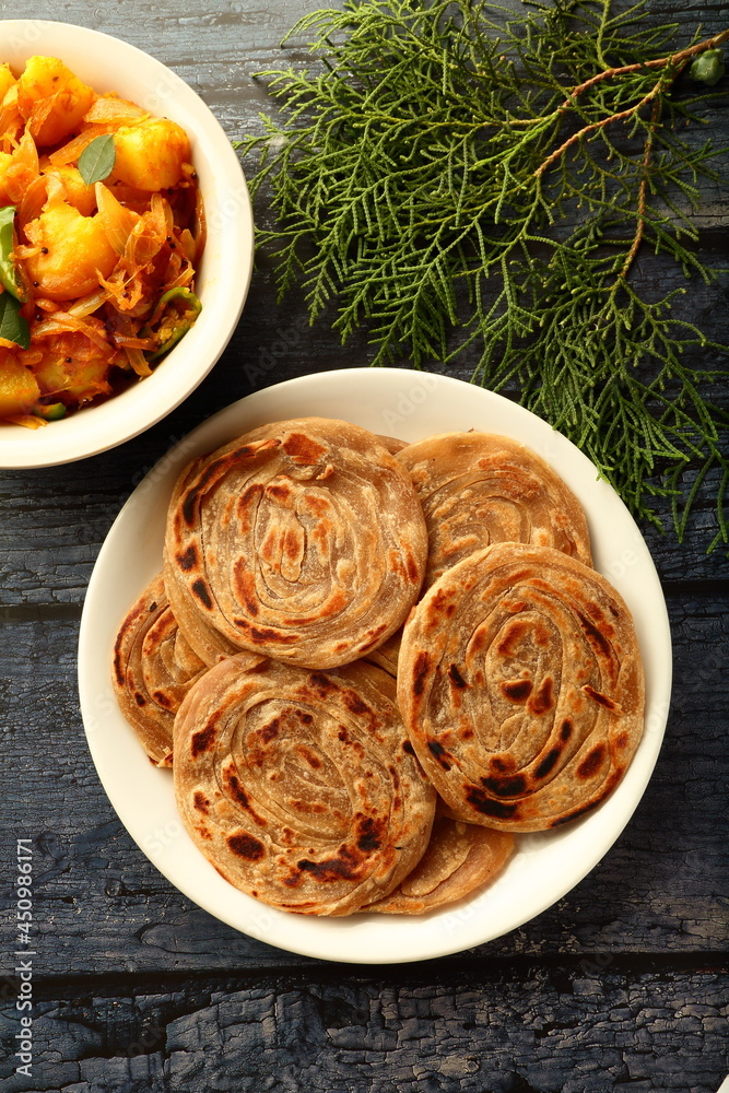 Delicious Indian vegetarian meal- homemade wheat paratha served with