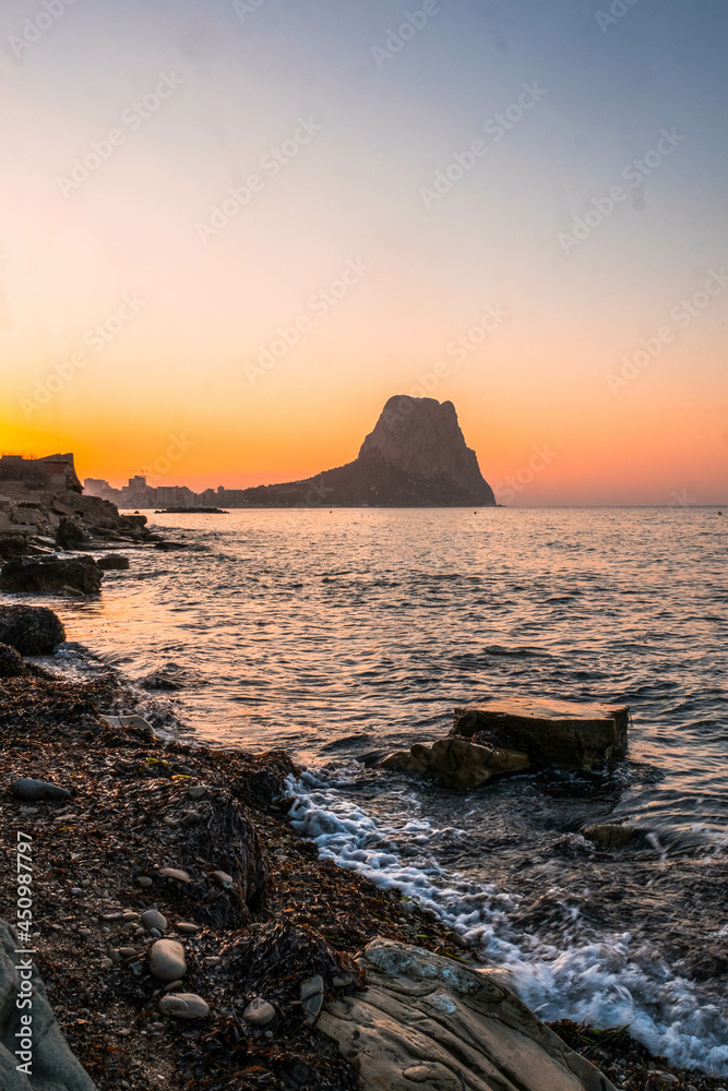 Calpe at sunrise on the Mediterranean coast of Alicante, Spain with views of the Ifach Rock