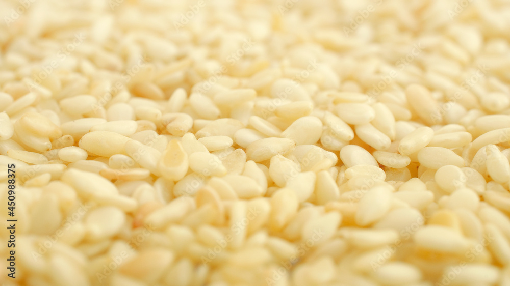 Background from sesame seeds, gergelim, top view, texture. Close-up of sesame seeds or gergelim. Sesamum indicum. Use as a background. Sesame seeds background, gergelim. Background from sesame seeds, gergelim, top view, texture. Close-up of sesame seeds or gergelim. Sesamum indicum. Use as a background. Sesame seeds background, gergelim.
