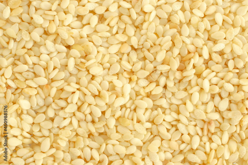 Background from sesame seeds, gergelim, top view, texture. Close-up of sesame seeds or gergelim. Sesamum indicum. Use as a background. Sesame seeds background, gergelim. Background from sesame seeds, gergelim, top view, texture. Close-up of sesame seeds or gergelim. Sesamum indicum. Use as a background. Sesame seeds background, gergelim.