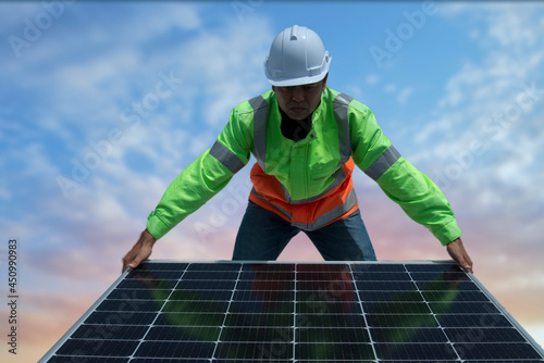 engineer or electrician working on replacement solar panel at solar power plant; working on repair solar panel to swap panel