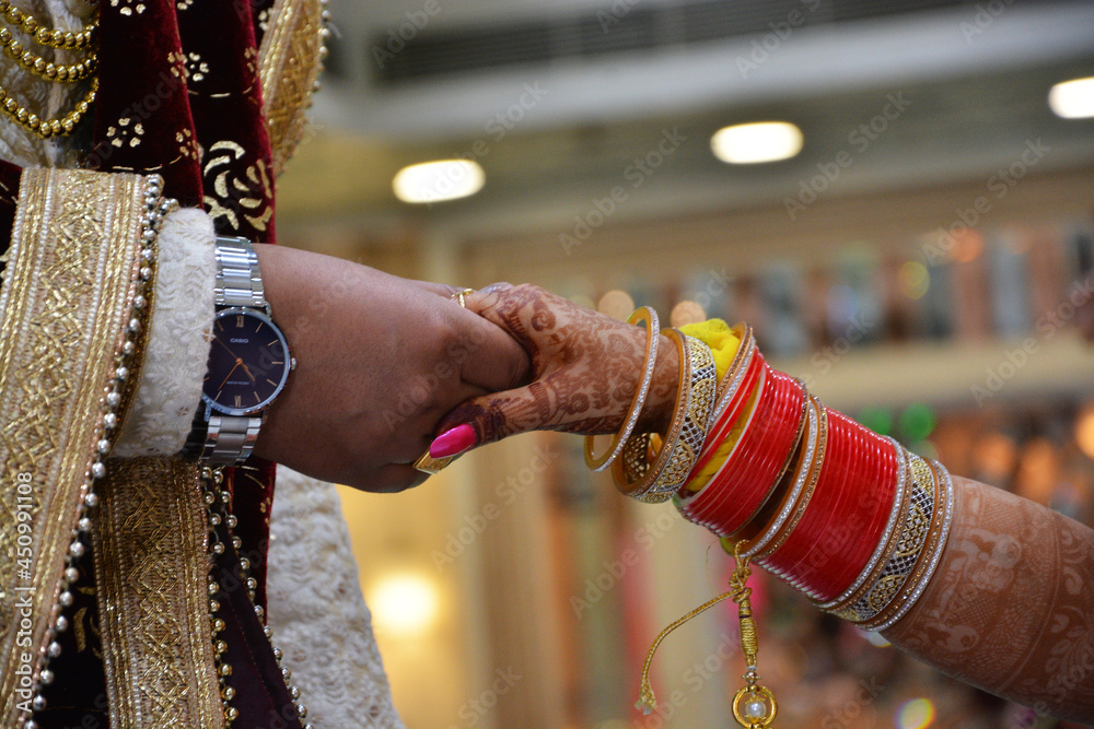 Groom Holding Bride Hand. Closeup Shot. Indian Wedding.