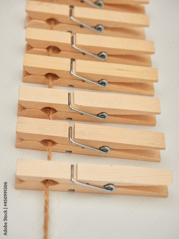 Set of wooden clothes pins on white background Set of wooden clothes pins on white background