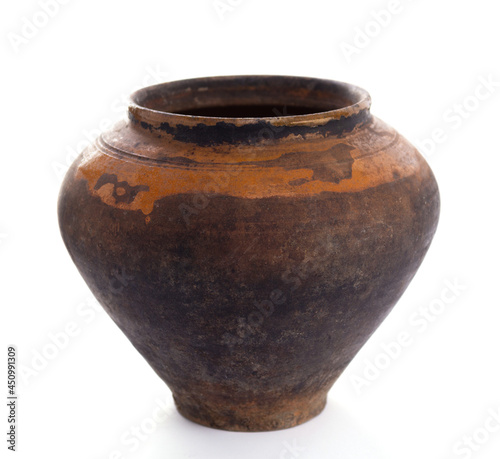Old clay pot isolated at white background. Ceramic or clay jar