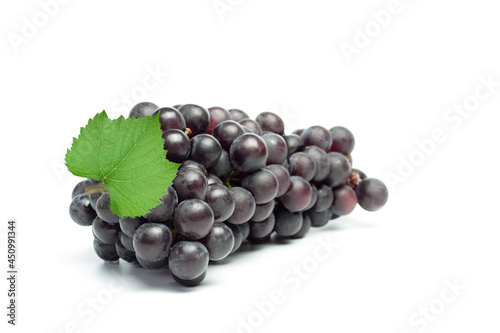 Quadro em tela Fresh black seedless grapes with leaf isolated on white background