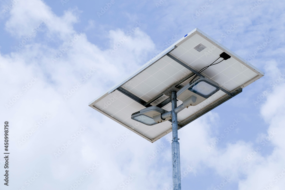 The electrical system is powered by solar energy. on the background sky and white clouds The electrical system is powered by solar energy. on the background sky and white clouds