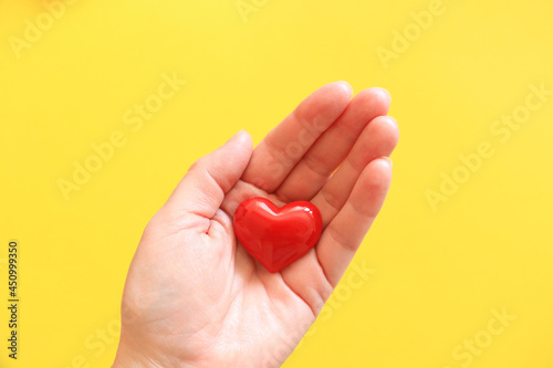 Woman holding heart symbol of love