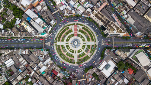 Aerial top view road roundabout with car lots in Bangkok City, Thailand, Circle Road traffic transport junction traffic road with vehicle movement