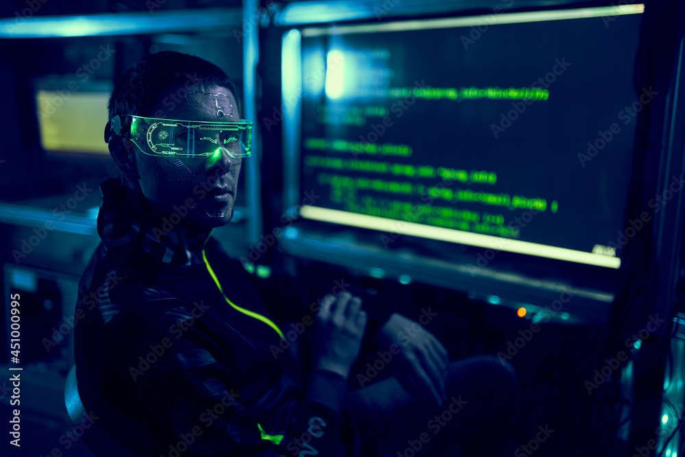 Cyber hacker breaks into databases to obtain information using a computer. Cyber hacker breaks into databases to obtain information using a computer.