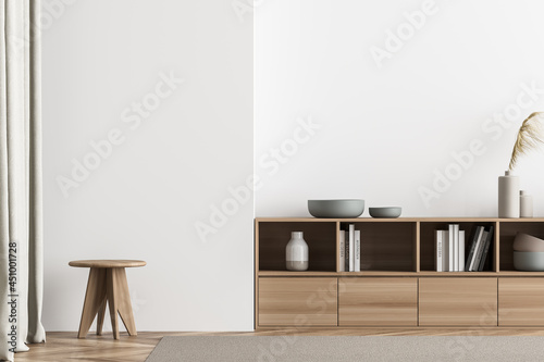 Minimalist light beige living room with stool photo