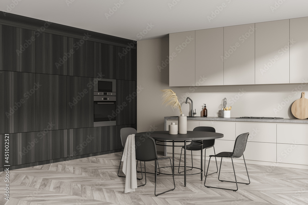 Corner of modern minimalist beige kitchen with dark wood area Corner of modern minimalist beige kitchen with dark wood area