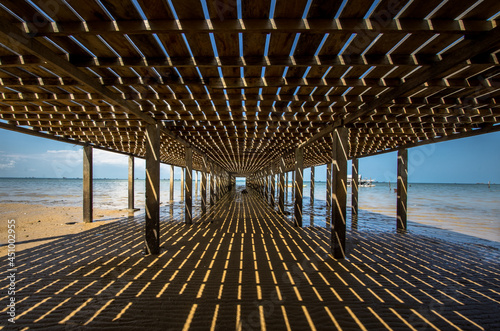 wooden human made pier at virgin beach of dabo singkep photo