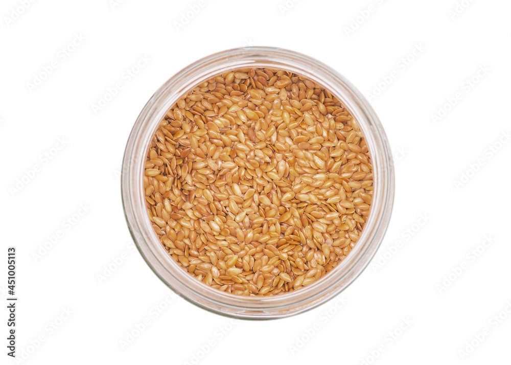 Flax seeds in a round glass jar with a lid. Isolated on white background. Condiments and spices. Flax seeds in a round glass jar with a lid. Isolated on white background. Condiments and spices.