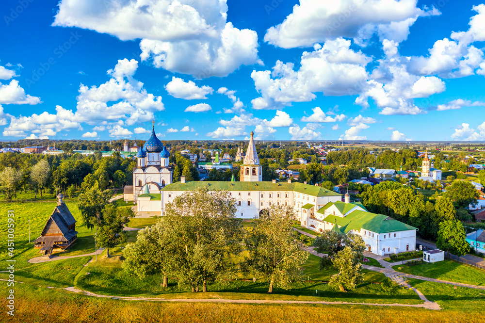 Aerial drone view of wooden Church of St. Nicholas with Kremlin in Suzdal, Russia. Summer sunny day