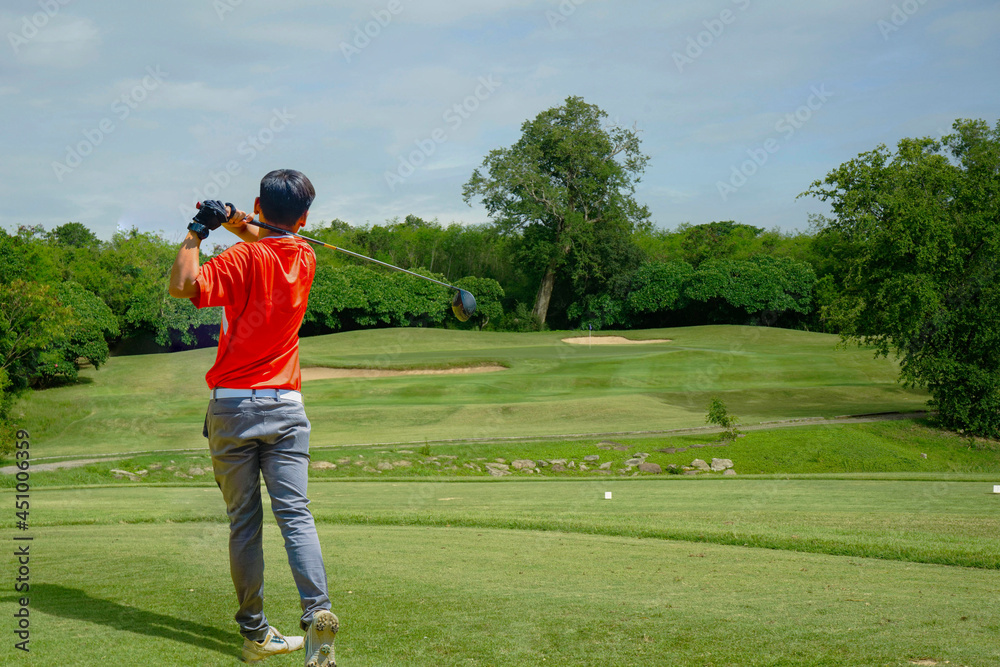 Golfer playing golf in the evening golf course, on sun set evening time. Golfer playing golf in the evening golf course, on sun set evening time.
