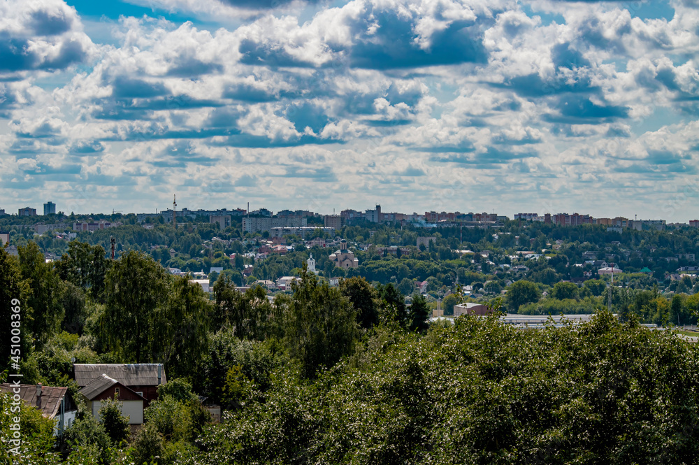 View of the town from the hill. Clouds over the city.
